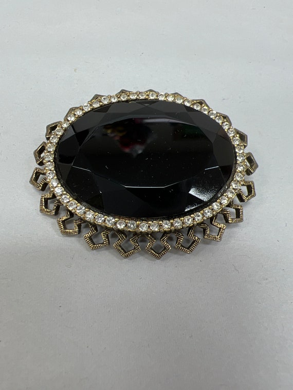 Black onyx and Rhinestone brooch 2 inches long.