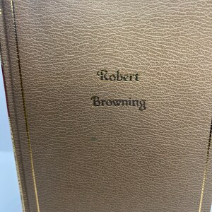 May include: A brown leather-bound book with gold accents and the text "Robert Browning" embossed on the front cover.