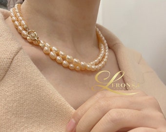 Victorian pearl necklace double strand around the bottom Set in gold setting! It\u2019s made out of mocha color sea pearls