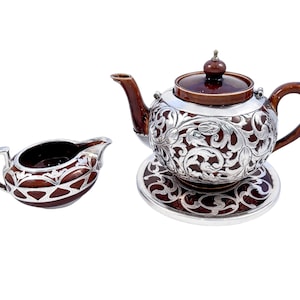 Antique Art Nouveau Lenox brown teapot, stand and creamer with sterling silver overlay
