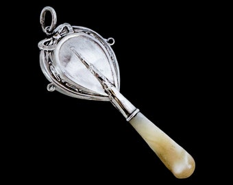 Antique Edwardian Chester sterling silver and mother of pearl baby rattle with bow decoration