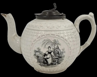 Antique 1820's Georgian moulded creamware teapot with black transfer print panels of lady with a birdcage