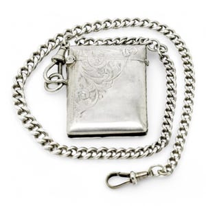 Antique WWI sterling silver vesta case engraved with scrolls, on a Victorian watch curb Albert chain