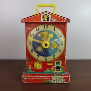 Clásico Vintage 1968 Fisher Price "Music Box Teaching Clock" #998 - Hecho en EE.UU. con componentes mecánicos japoneses