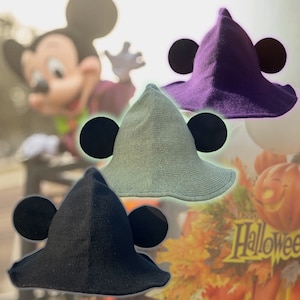 May include: Three witch hats with Mickey Mouse ears. The hats are in black, purple, and green.