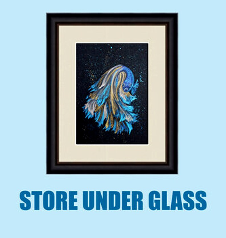May include: Framed artwork featuring a blue and gold betta fish against a dark background with a starry effect. The artwork is in a black frame with a cream-colored mat. The text "STORE UNDER GLASS" is at the bottom.