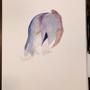 May include: Watercolor painting of a flower in shades of blue, purple, and brown. The petals are layered and create a soft, flowing shape. The artwork is on a white background.