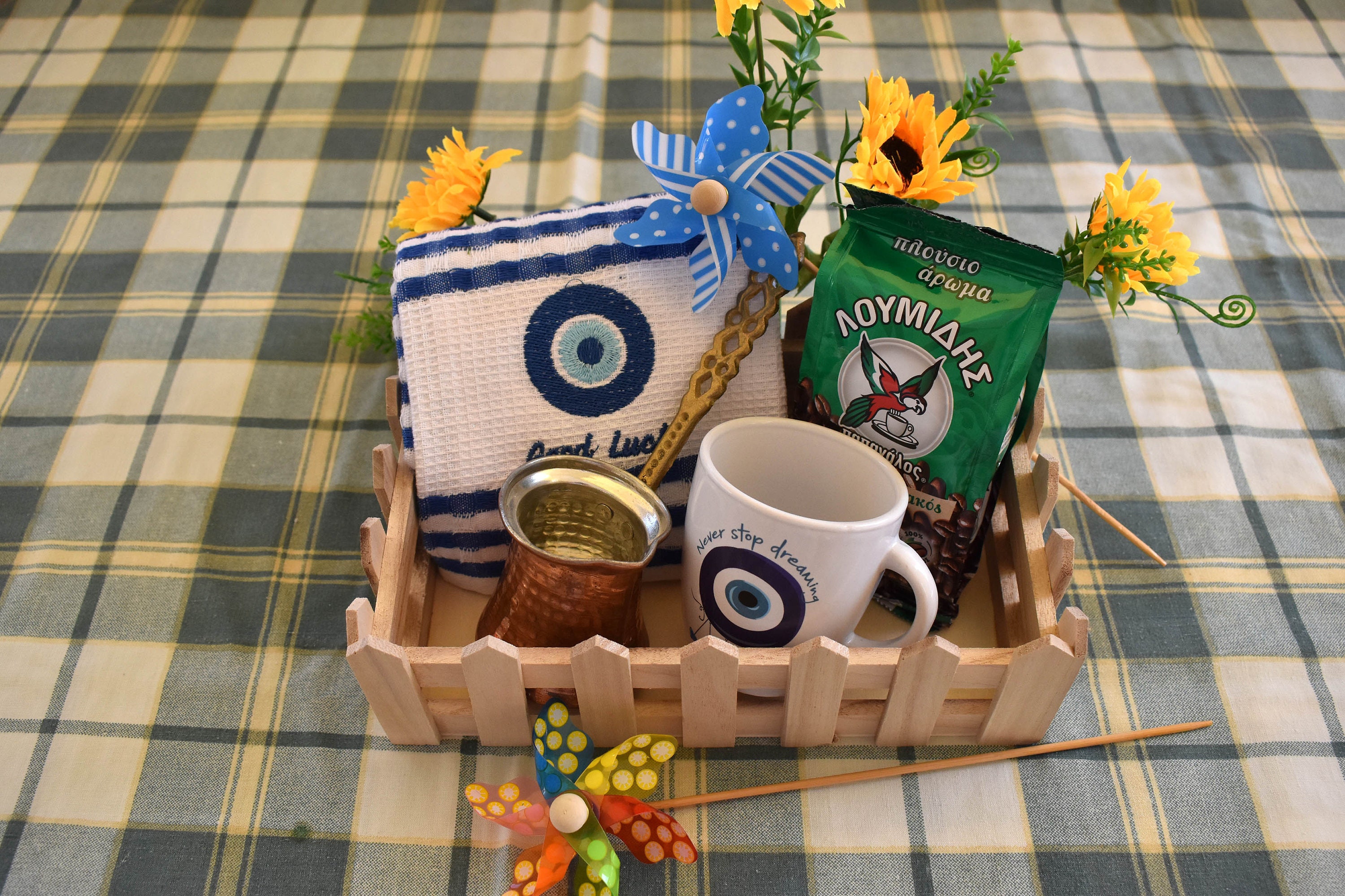 Greek gift basket with coffee. Greek coffee, coffee pot, kitchen towel