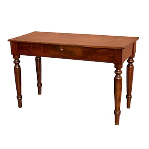 May include: A rectangular wooden desk with a single drawer and turned legs. The desk is a warm brown color and appears to be made of solid wood. The drawer has a small, round knob. The desk is a classic piece of furniture.