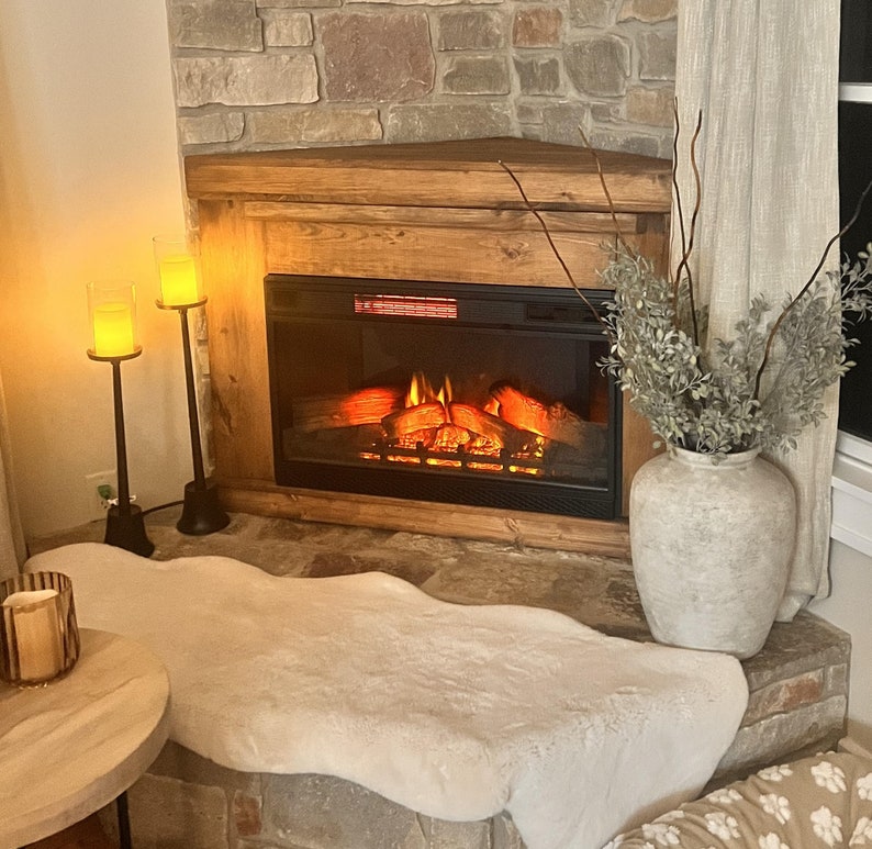 Custom free standing fireplace cabinet console to hold or mount an LED electric fireplace. TV stand with a fireplace heater. Handmade from solid pine wood in a farmhouse rustic country style. Corner unit to mount an LED insert.