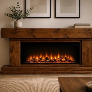 May include: A rectangular electric fireplace featuring a dark brown wood-grain finish mantel and base. The central firebox displays a glowing orange flame effect with artificial logs arranged horizontally across the bottom of the interior space.