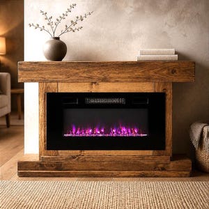 May include: A rustic wooden fireplace mantel featuring a rectangular frame with a dark brown finish and visible wood grain. The center contains a black electric fireplace insert displaying vibrant purple and blue flames behind a glass panel.