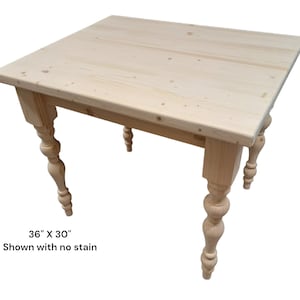 May include: A light-colored, unfinished wooden table with a square top and turned legs. The table measures 36 inches by 30 inches. The text on the image reads "Shown with no stain."