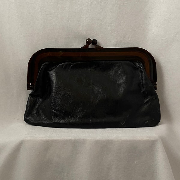 Vintage 60s black leather clutch with kiss-lock closure and transparent brown plastic frame