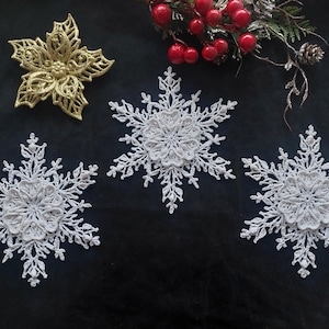 A set of crocheted snowflakes, a Christmas tree decoration