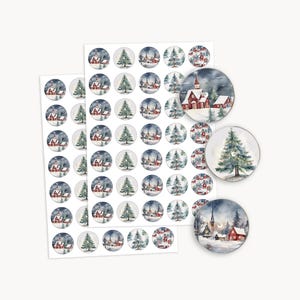 May include: Sheets of Christmas-themed stickers featuring watercolor illustrations of snowy villages and evergreen trees. The stickers are round and have a white border. Some stickers are loose, showing the design in detail.