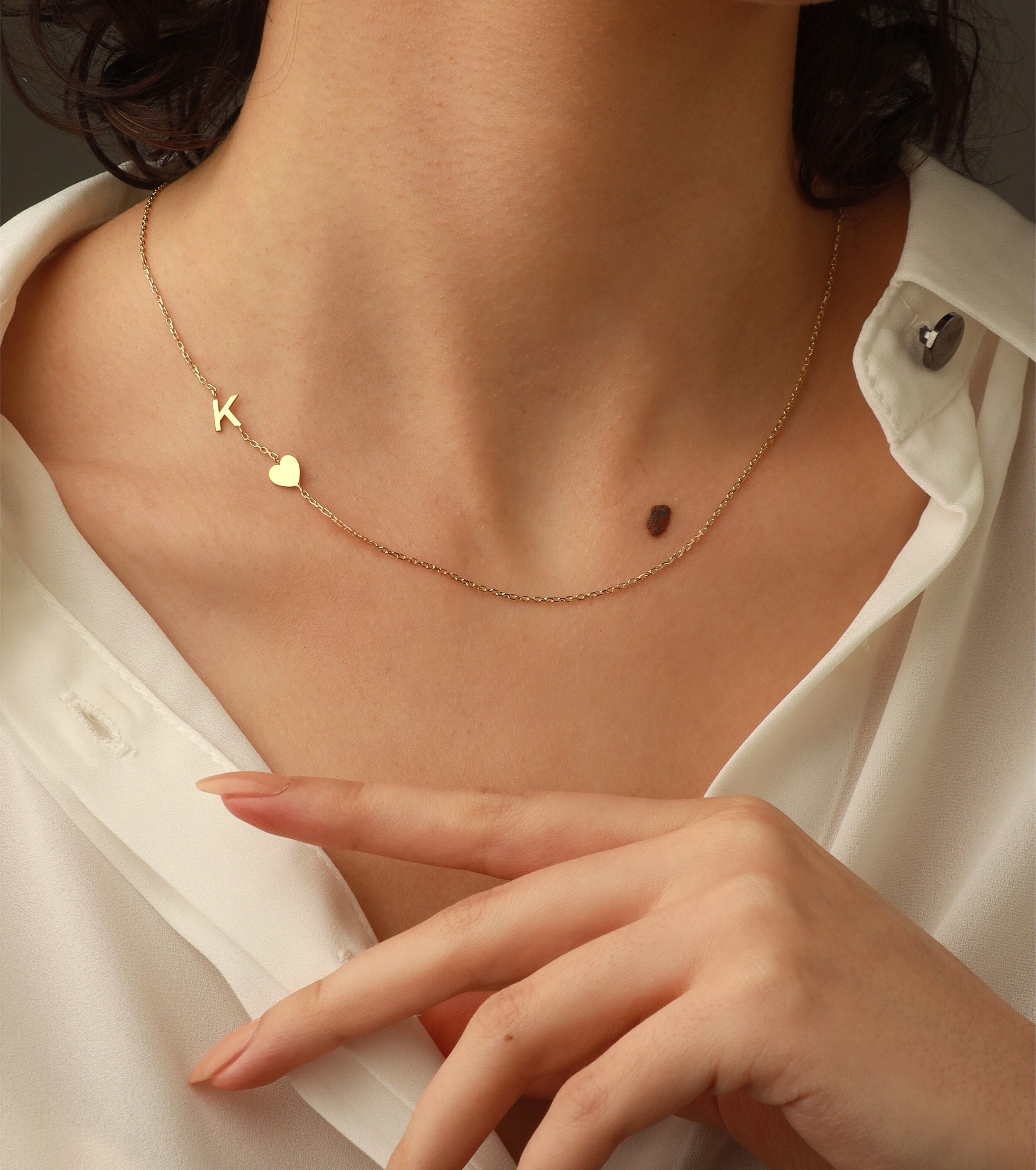 Gold sideways letter necklace online