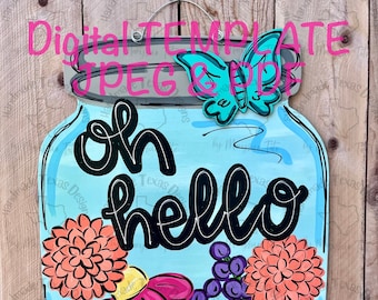 May include: A blue mason jar with the words "oh hello" in black lettering. The jar is filled with colorful flowers and butterflies. The jar is on a wooden background.