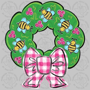 May include: A whimsical wreath design featuring a green wreath adorned with cartoon bees and pink flowers. A large pink and white gingham bow is at the bottom. The design is by Marysue Tate.