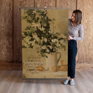 May include: A handmade wooden sign displaying the word "Welcome" in a whimsical font. The white-painted sign has a distressed finish and is adorned with a floral design in pink and green hues. Suitable for hanging on a door or wall.