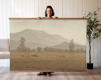 May include: A sepia-toned landscape painting depicting a field with a mountain range in the background. The painting is framed in a simple wooden frame.