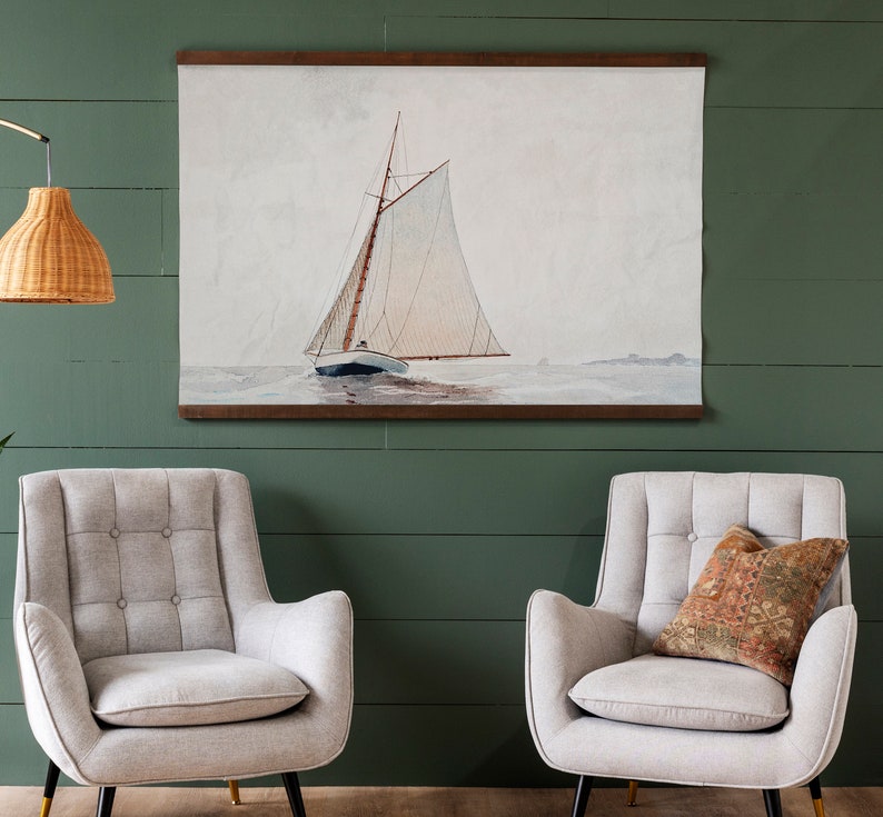 May include: A framed watercolor painting of a sailboat with white sails on a calm body of water. The painting is in a wooden frame and has a white mat.