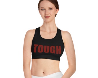 May include: Black sports bra with a red "TOUGH" graphic print.