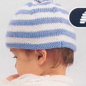 May include: A knitted hat with alternating blue and white stripes. The hat has a blue brim and a small pom-pom on top. The hat is designed for a baby or toddler.