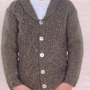 May include: A grey button-down cardigan with a shawl collar. The knitted sweater has a textured pattern and four white buttons. The long sleeves and the material suggest it is made of wool. The sweater is designed for warmth and comfort.