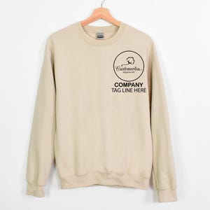 a sweater hanging on a hanger on a wall