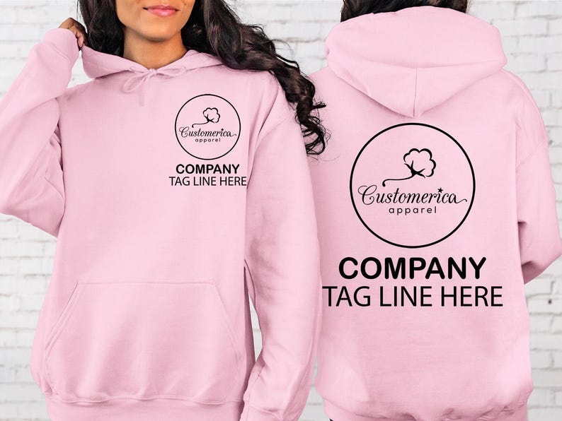 a woman wearing a pink sweatshirt with a company tag on it