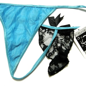 May include: A pair of blue and black lingerie with a lace trim. The tag reads "Planet Lingerie".