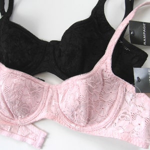 May include: Two lace bras, one black and one pink, with the brand name "Rampage" on the tags.