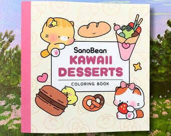 May include: A square coloring book with a pink spine and the title "SanoBean Kawaii Desserts." The cover features cartoon illustrations of desserts like a crepe, macaron, and pretzel, along with cute animal characters. The background is a light cream color.