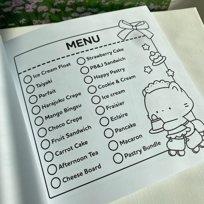 K&ouml;nnte beinhalten: Eine schwarz-wei&szlig;e Men&uuml;seite mit einer Liste von Desserts, darunter Eis, Cr&ecirc;pes und Kuchen. Das Wort "MENU" steht oben. Auf der rechten Seite der Seite befindet sich eine Cartoonfigur.