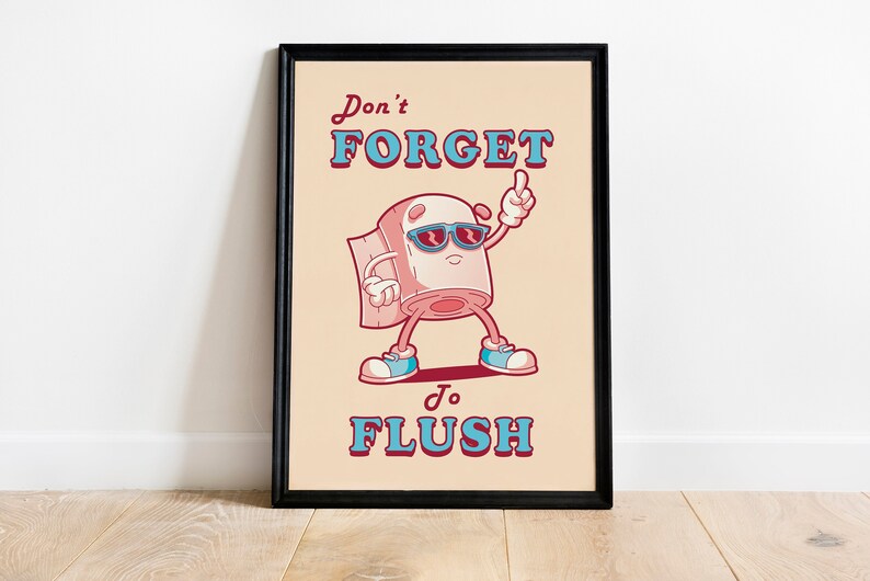 May include: A humorous poster with a cartoon toilet paper roll wearing sunglasses and pointing with one finger. The text on the poster reads "Don't Forget to Flush".