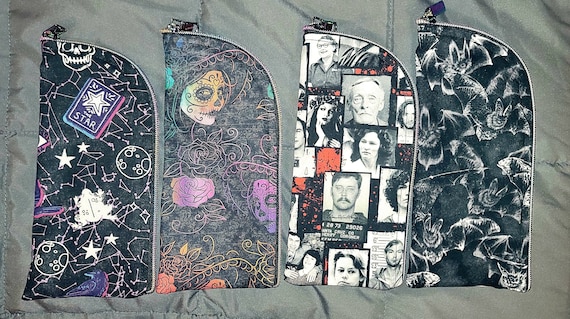 Pencil/glasses cases. Serial killer, day of the dead, bats, cats.