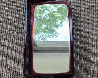 Vintage bathroom mirror with two magnifying mirrors.