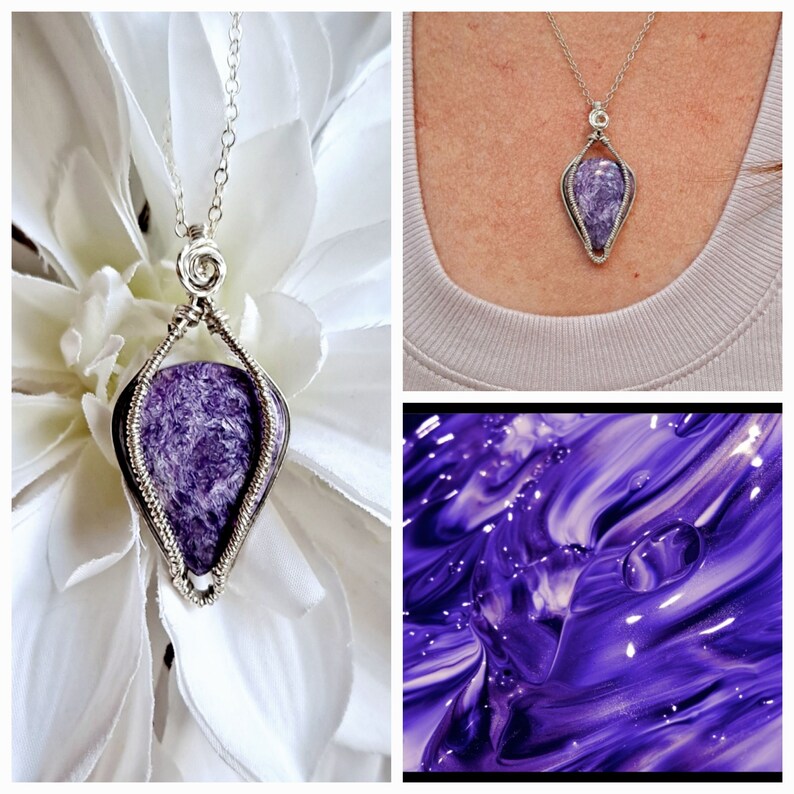 May include: A silver wire wrapped pendant featuring a purple amethyst stone. The pendant is hanging from a silver chain and is displayed on a white flower.