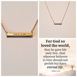 May include: Gold necklace with a bar pendant that says "John 3:16". The necklace is on a white background. The image also includes a quote from John 3:16.