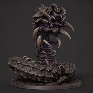May include: A dark purple and charcoal gray creature figurine with a segmented, armored body and a coiled tail. The creature features a wide, open mouth with multiple sharp, curved fangs and spikes protruding from its back and sides, standing on a circular base.