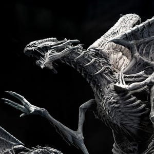 May include: A detailed grayscale sculpture of a dragon with outstretched wings and a menacing pose. The dragon's skeletal structure is visible, with sharp claws and teeth. The text "20CM TALL" is at the bottom. The sculpture is approximately 7.8 inches tall.