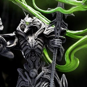 May include: A detailed sculpture with a dark gray finish, featuring an intricate design and a flowing, neon green element. The sculpture is mounted on a white base, with the text "TECHNOCRON II H.R. GIGER TRIBUTE" above it.