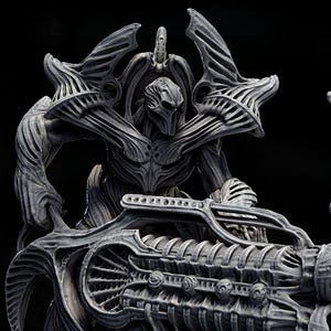 May include: Three gray sculptures of biomechanical figures, each posed differently. The central figure holds a large, detailed weapon. The text "TECHNOCRON H.R.GIGER TRIBUTE" is displayed above the figures. The sculptures are on circular bases.