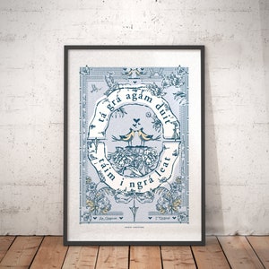 May include: A blue and white framed print with a floral design and two birds perched on a branch. The text in the image reads "Tá grá agam duit, táim i ngrá leat".