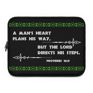May include: Black laptop sleeve with a green border and a white quote that reads "A man's heart plans his way, but the Lord directs his steps. Proverbs 16:9"
