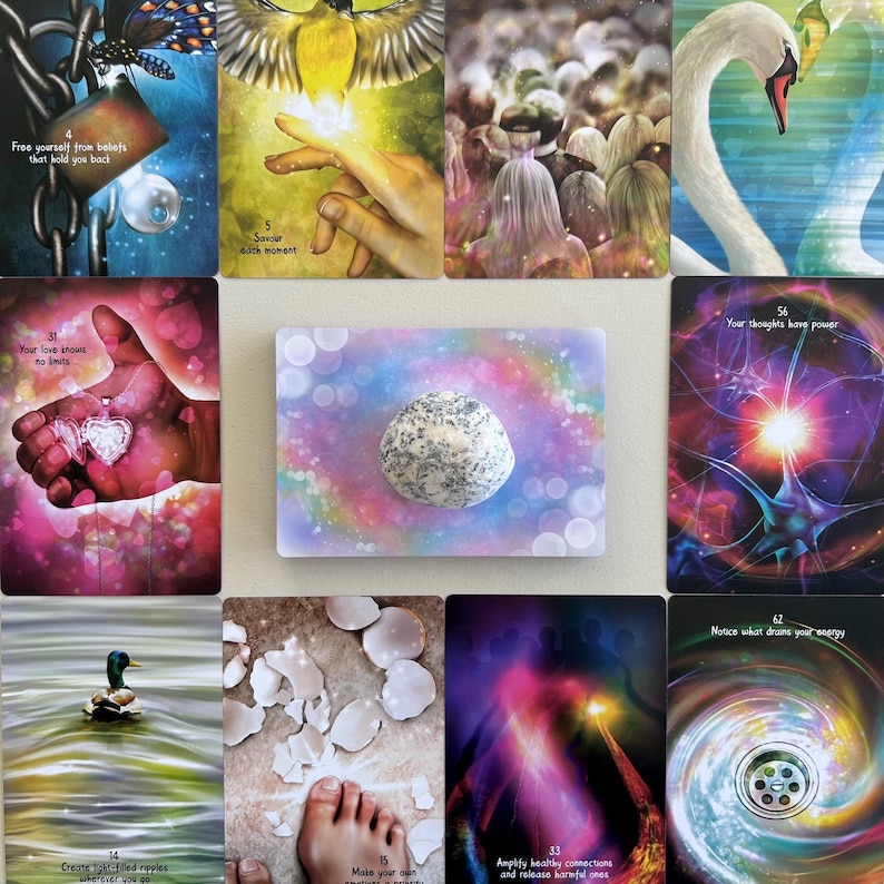May include: A set of 10 colorful oracle cards with various images, including a heart, a butterfly, a hand, a stone, and a swirling galaxy. The cards are arranged in a grid pattern on a light background. The text on the cards includes phrases like "Free yourself from beliefs that hold you back" and "Your love knows no limits".