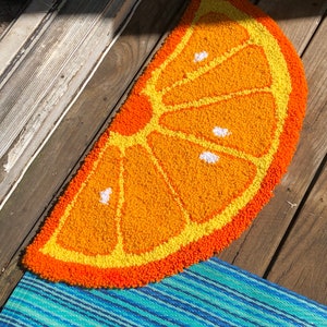 Handmade orange fruit half circle rug