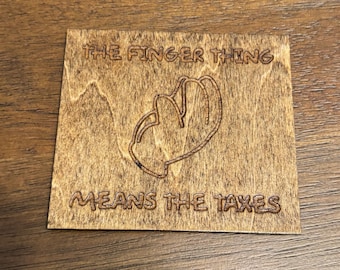 Stained basswood magnet of &quot;the finger thing means the taxes&quot; from the Simpsons with semi gloss finish