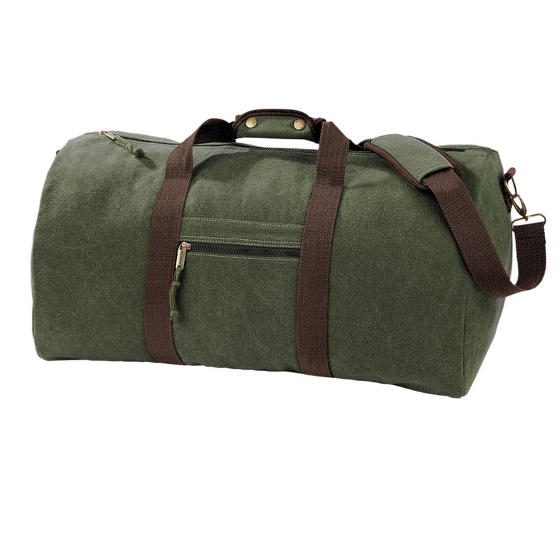May include: A green canvas duffel bag with brown leather straps and a zippered pocket. The bag has a top handle and a shoulder strap.